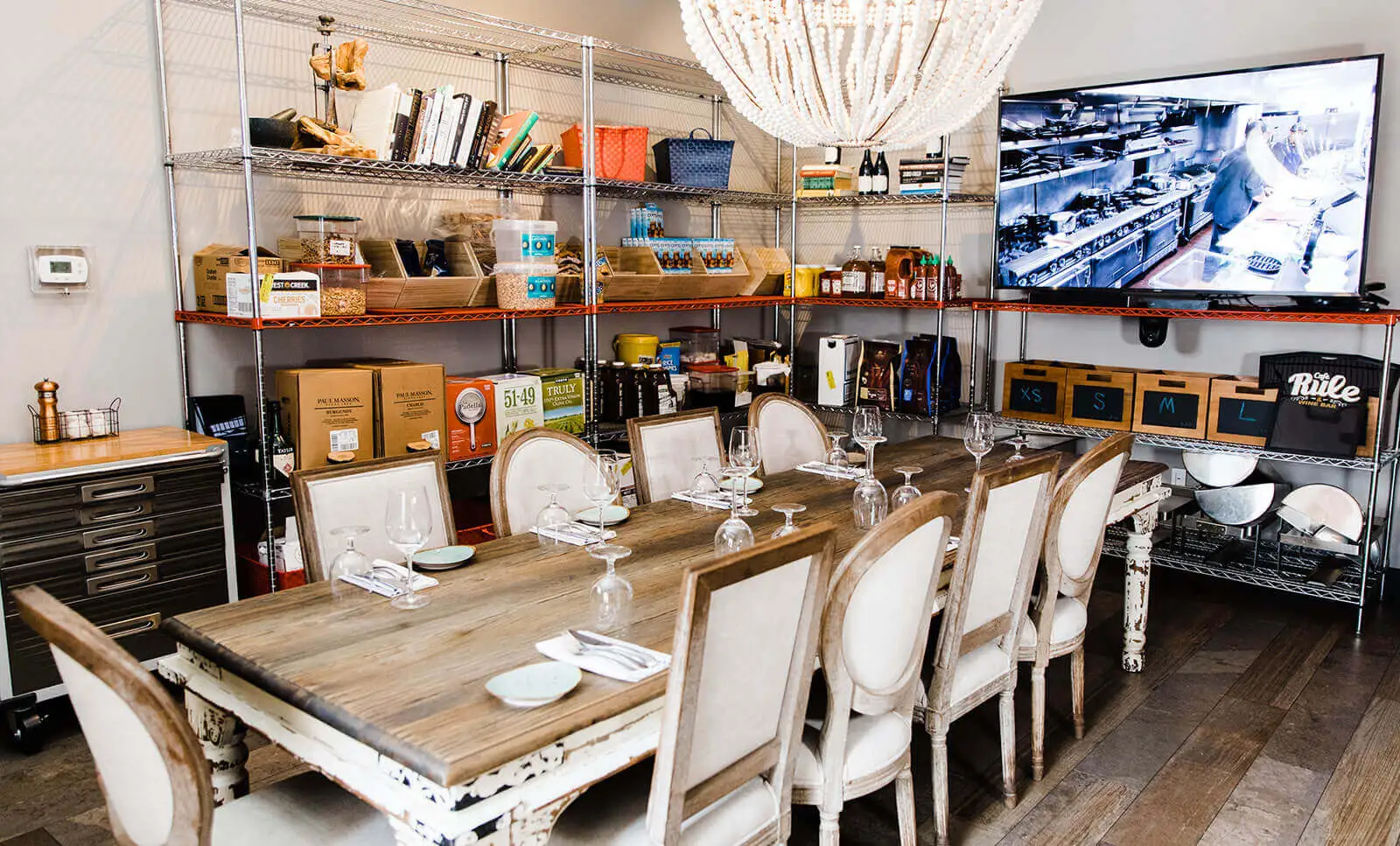 chefs table cafe rule private party reservation fancy elegant long dinner table chandelier tv intera
