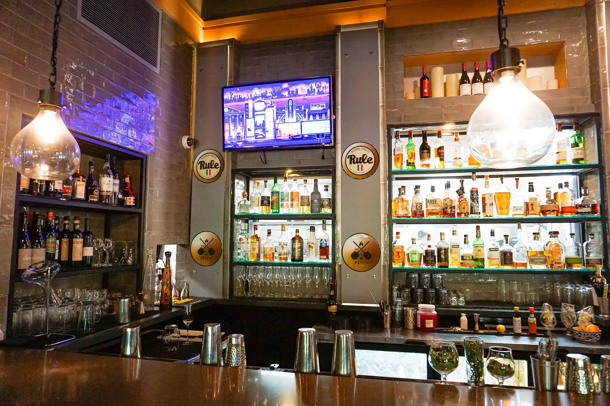 rule prime pasta bar area modern design with bottle display polished surface and warm industrial lighting hickory nc