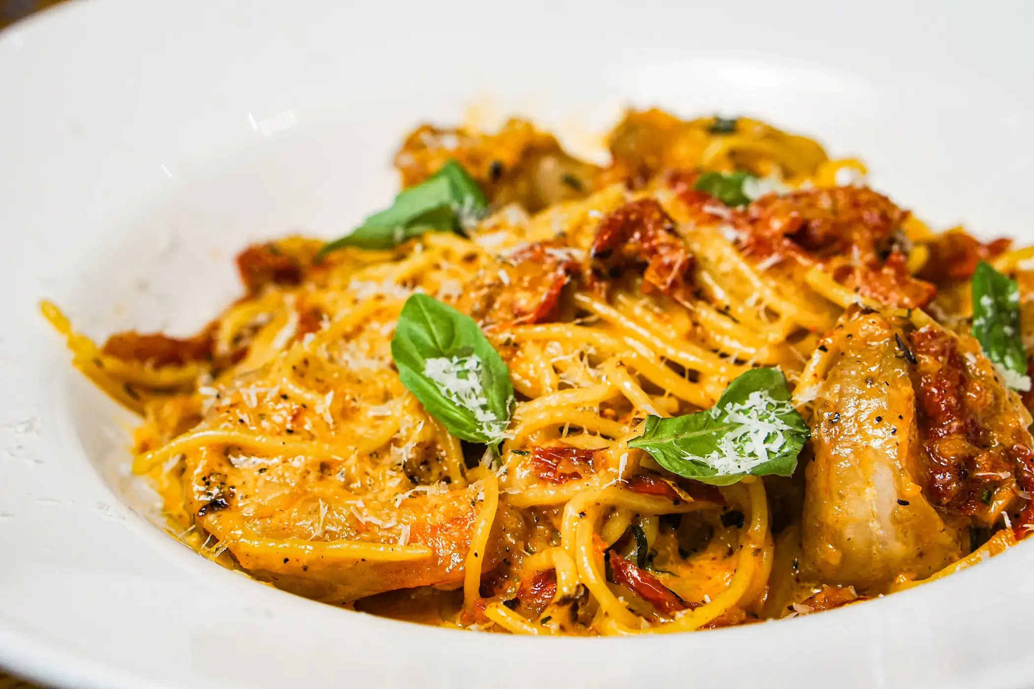 rule prime pasta closeup pasta dish with fresh garnish on white plate soft lighting detailed food presentation hickory
