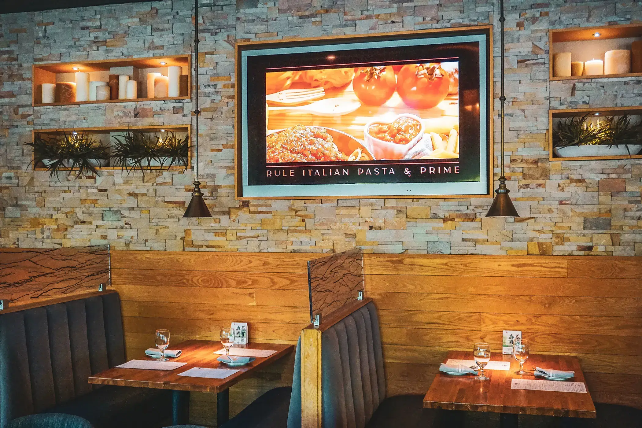 rule prime pasta cozy rustic italian interior with wood and stone soft lighting brick texture warm ambience hickory nc