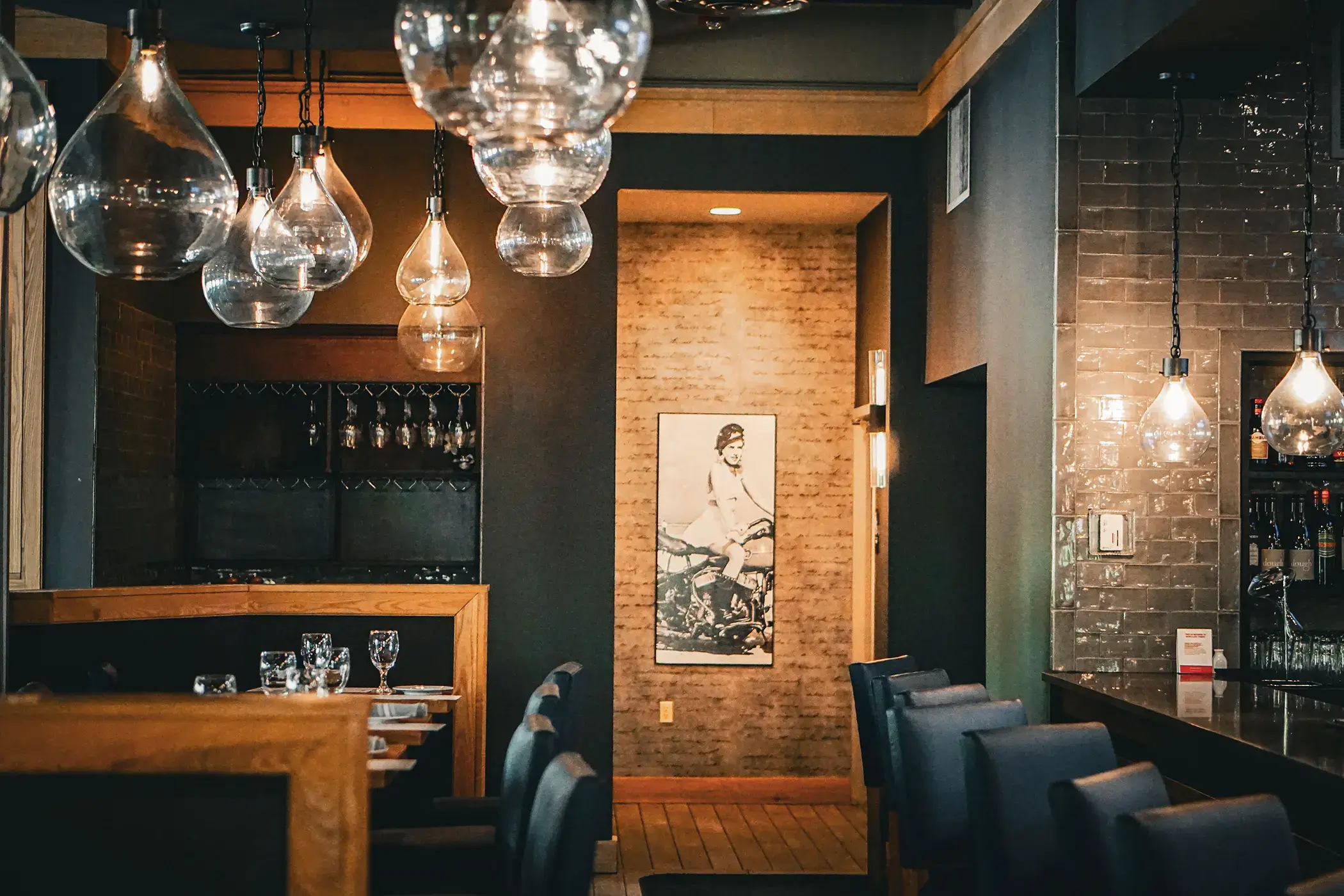 rule prime pasta modern dining room with elegant light fixtures warm ambience wood and metal decor rustic touch hickory