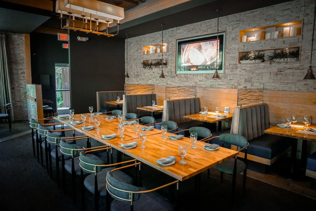 rule prime pasta modern rustic dining room with wooden tables warm lights brick stone details inviting atmosphere hicko