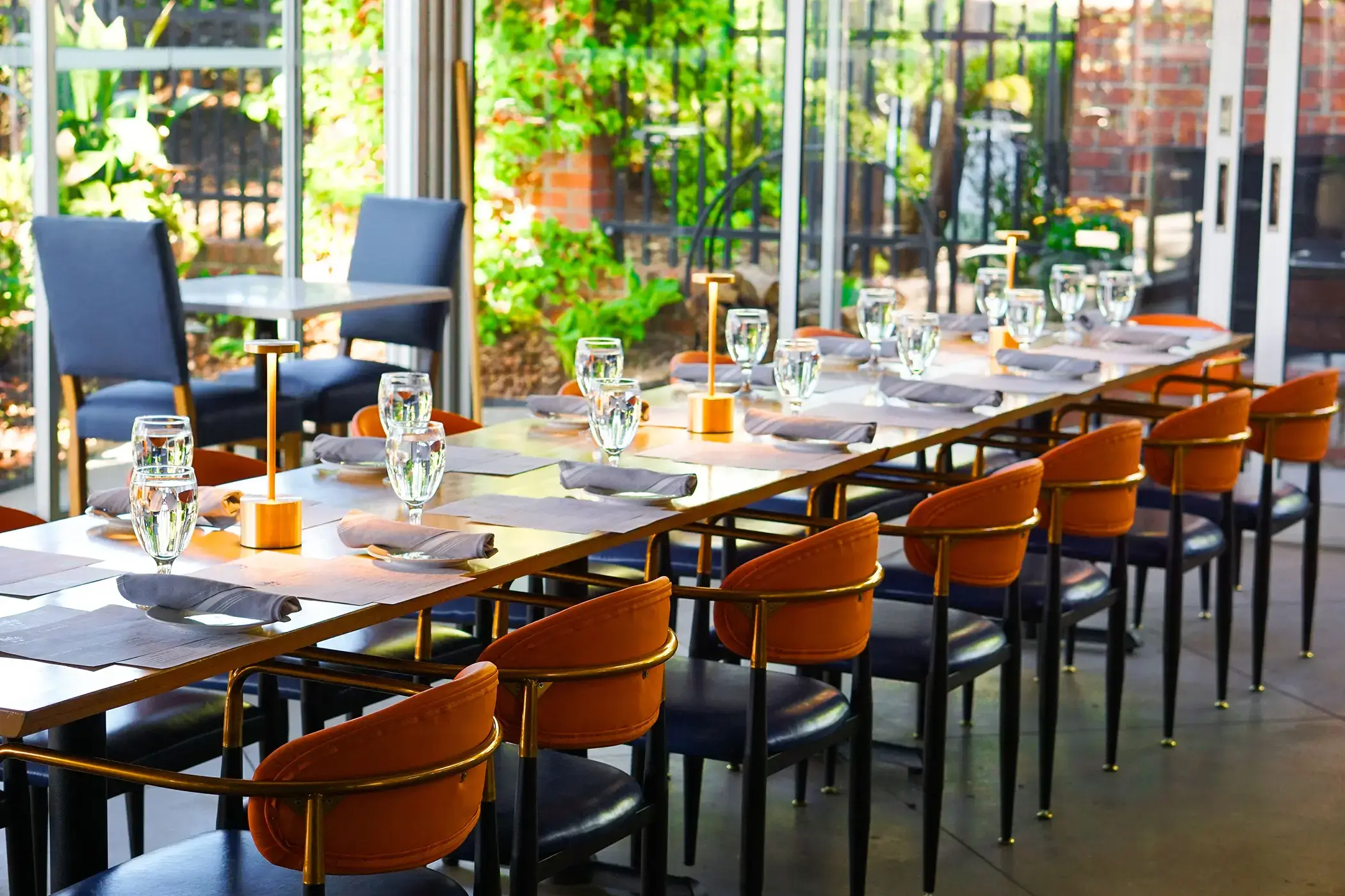 rule prime pasta the patio modern dining table with greenery gold accents and natural light hickory nc